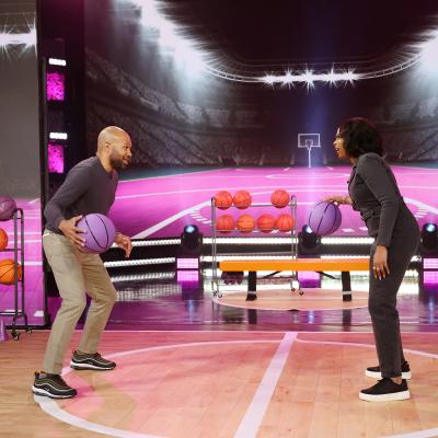 Derek Fisher stops by to help Jennifer warm up and shoot hoops.